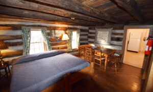 Living room with King Bed and Dining Table Beyond