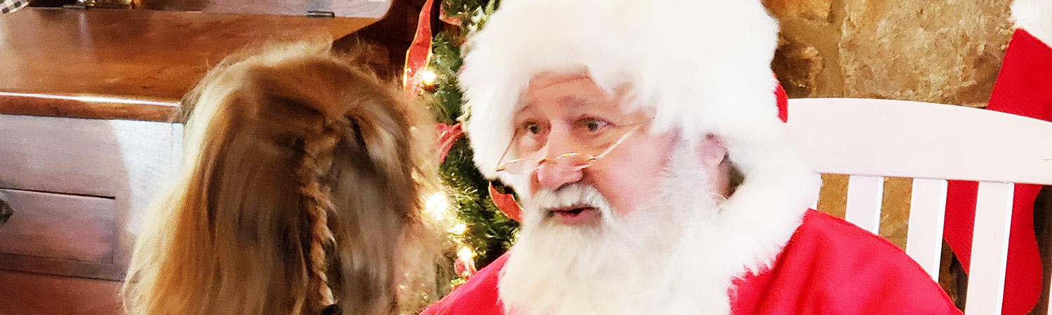 Santa greeting young ones at the Graves Mtn Community Holidays Fair