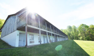 Shared Porches with Rockers and Exterior Lodge Room Entrances - for Shenandoah National Park View Hotel at Graves Mountain