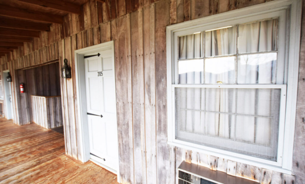 Shared Porches with Rockers and Exterior Lodge Room Entrances - for Shenandoah National Park View Hotel at Graves Mountain