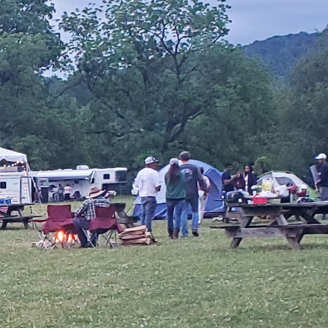 Getting ready for catered Saturday night dinner - with campfire and Austin Boggs singing country solos.
