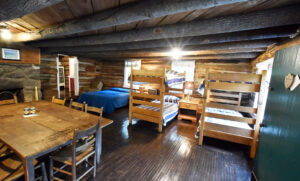 Upper Cabin - communal family table, living, and sleeping room - the whole of the groundfloor