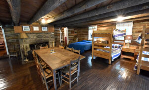 Upper Cabin - communal family table, living, and sleeping room - the whole of the groundfloor